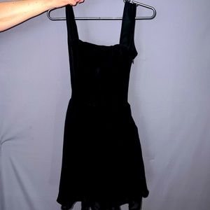 Black dress with open back gold detailing